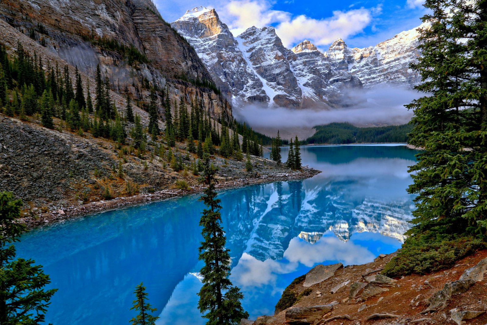 Blue water and mountain peaks at Moraine Lake, Canada