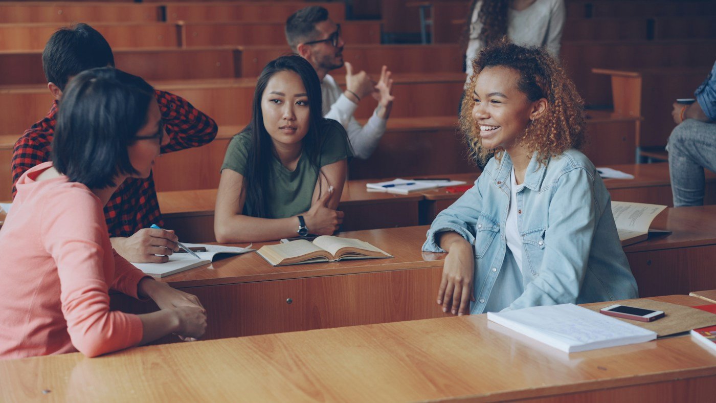 Students sharing ideas and learning together in a university lecture room
